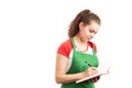 ÃÂ Female storekeeper or supermarket employee writing in notebook